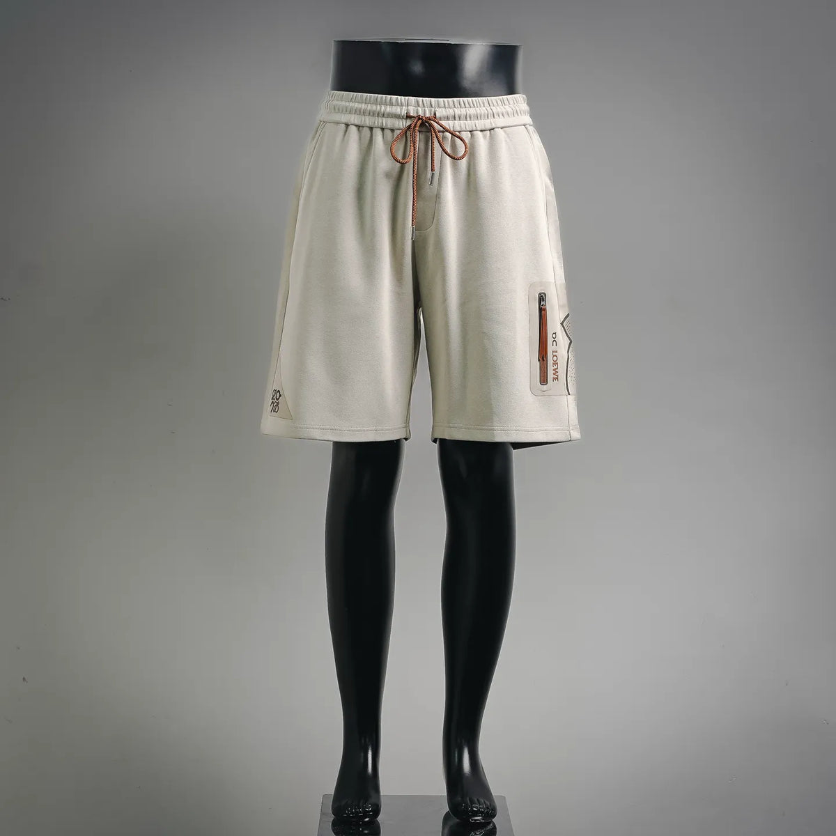 Light cream drawstring shorts with side vents and front pockets