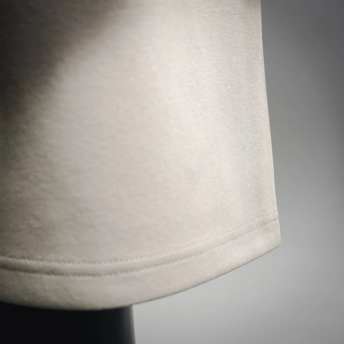 Light cream shorts hem with simple seam finish