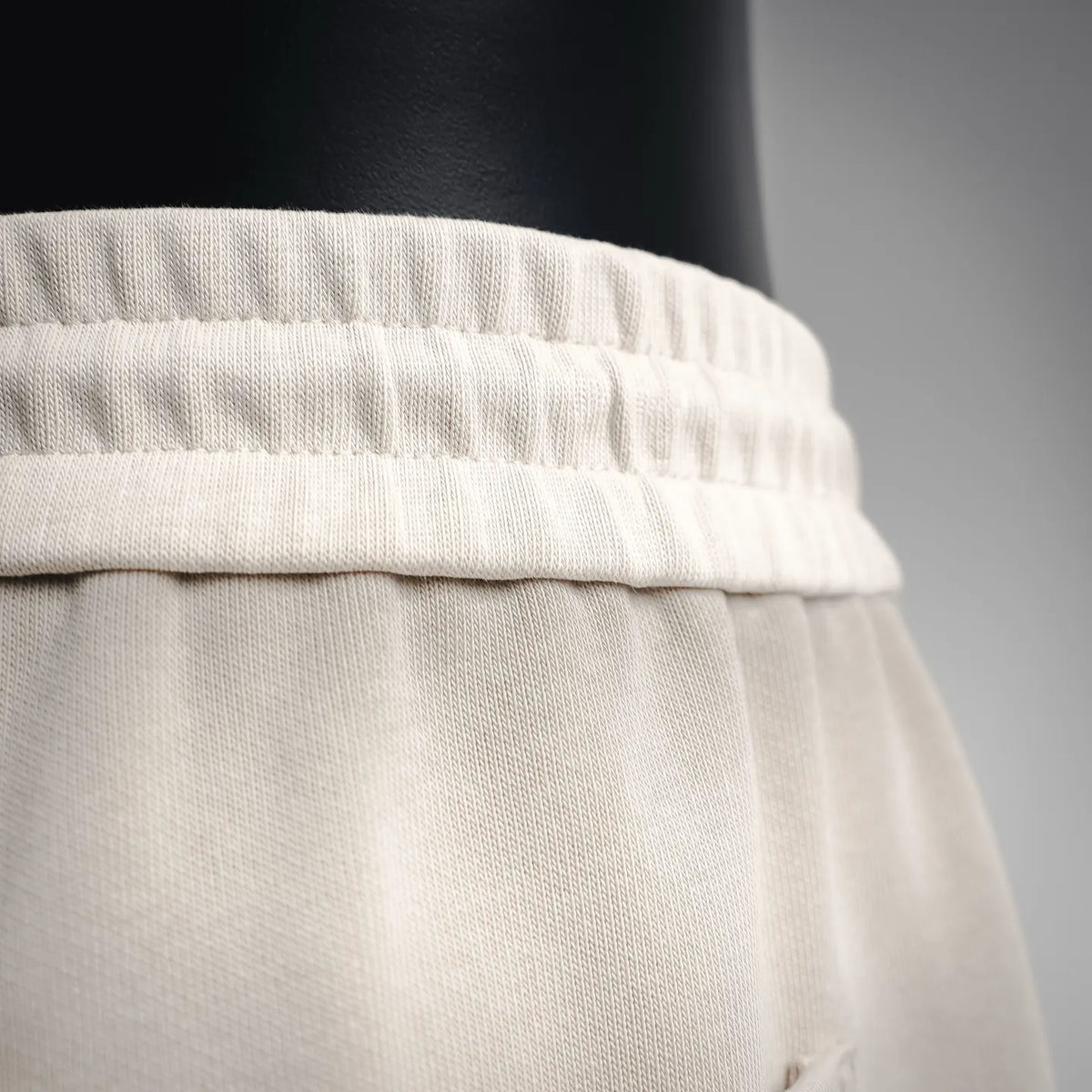 Light cream elastic waistband with textured fabric finish