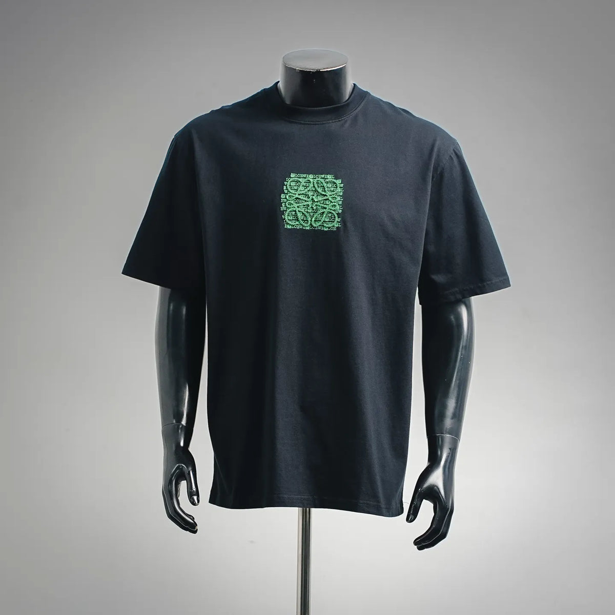 Navy short-sleeve T-shirt with small green LOEWE logo graphic on chest