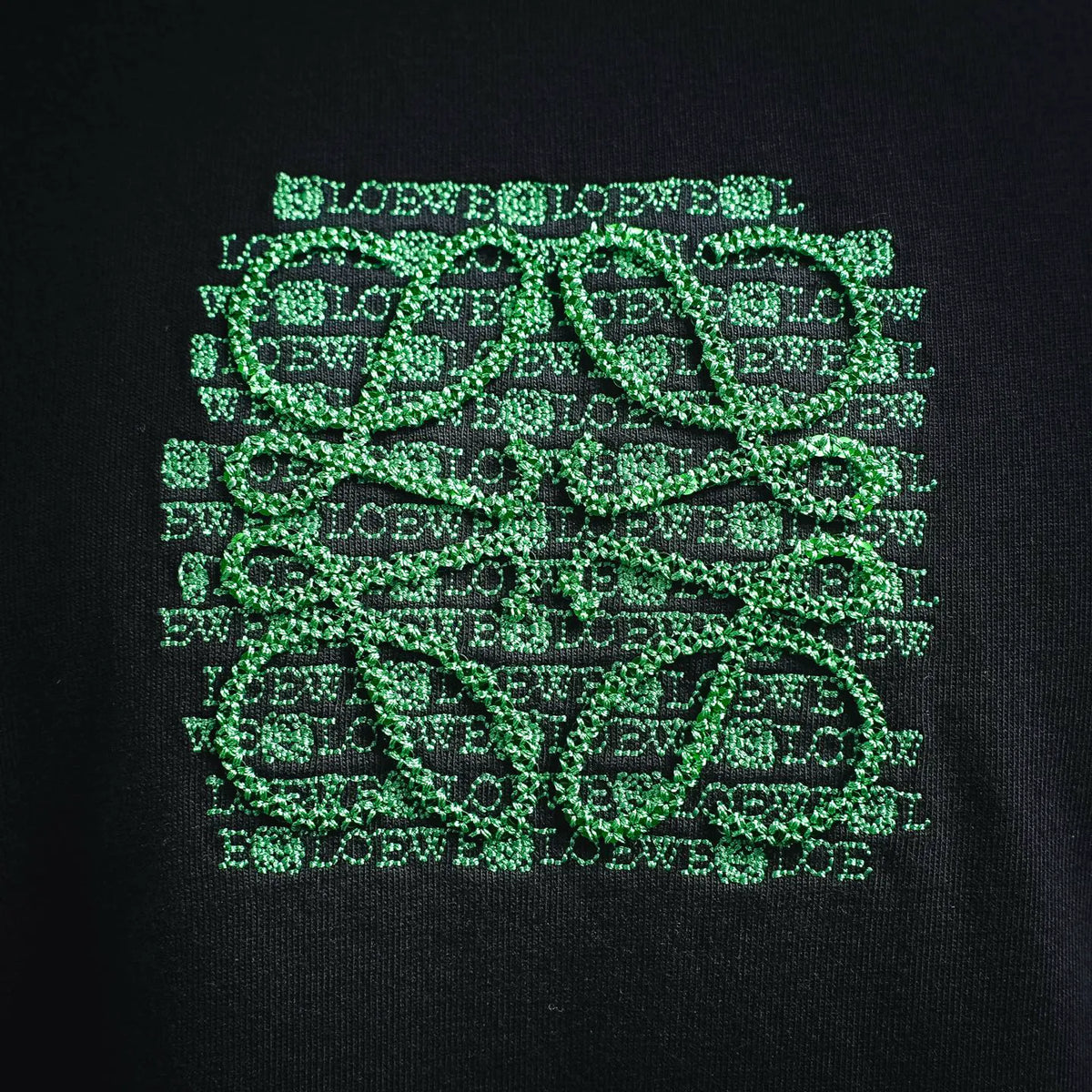 Navy T-shirt with green LOEWE emblem pattern graphic on chest
