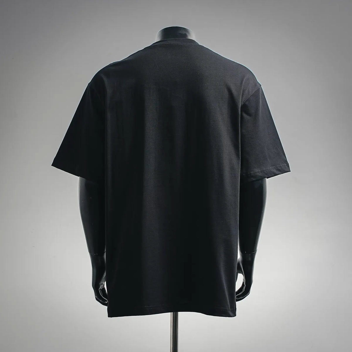 Black short-sleeve t-shirt on a mannequin, back view