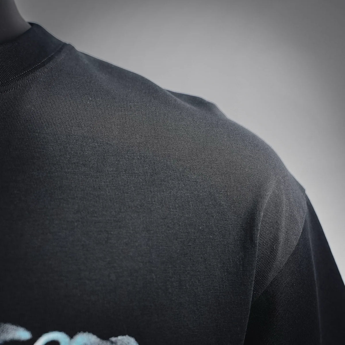 Black short-sleeve t-shirt fabric texture with crew neckline
