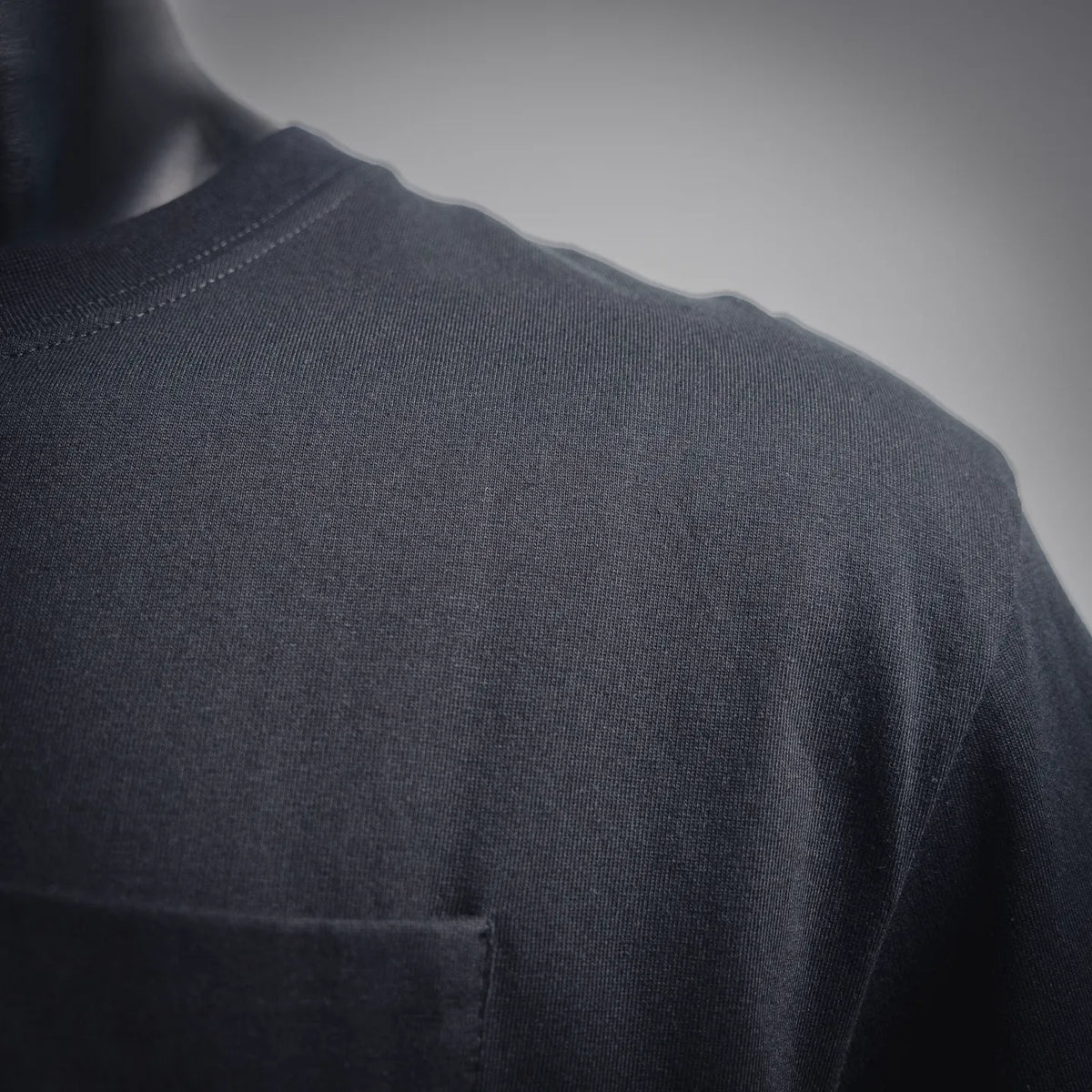 Black short-sleeve T-shirt fabric and neckline close-up