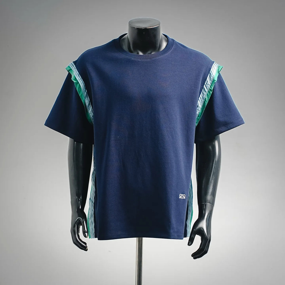 Dark navy short-sleeve T-shirt with green-and-white striped side panels