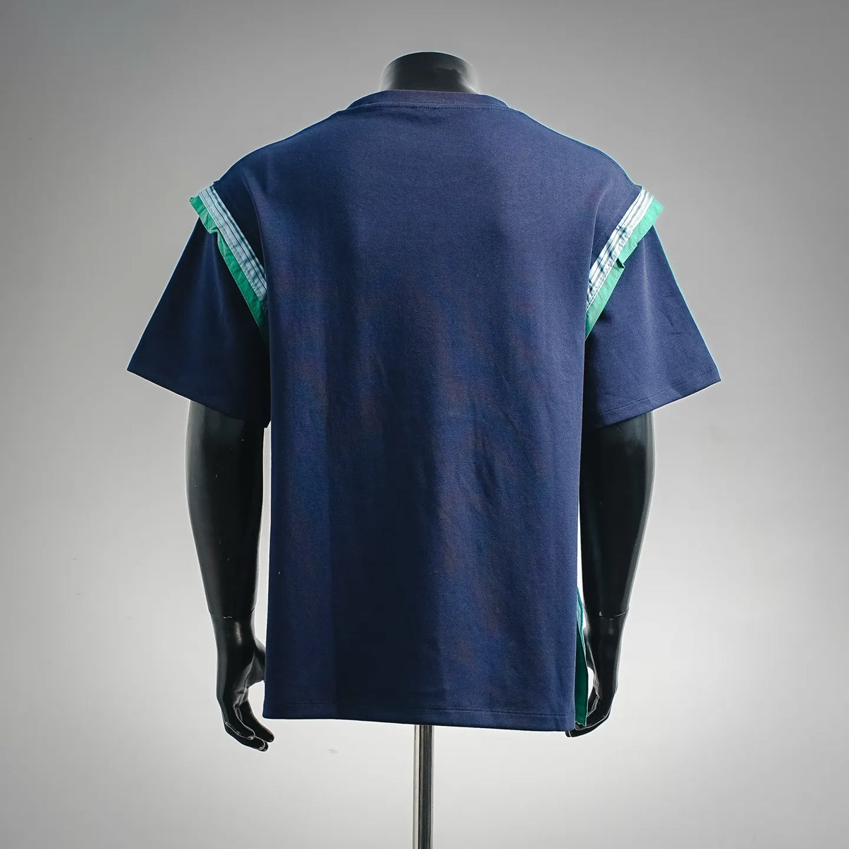 Dark navy short-sleeve T-shirt with green-and-white striped back side panels