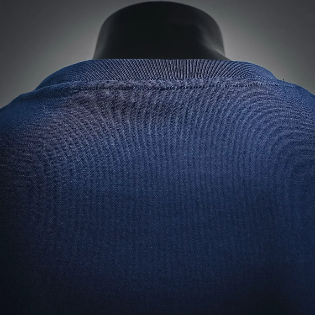 Dark navy T-shirt neckline seam close-up