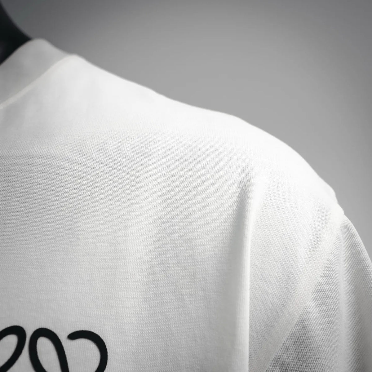 LOEWE white short-sleeve T-shirt back shoulder and fabric close-up