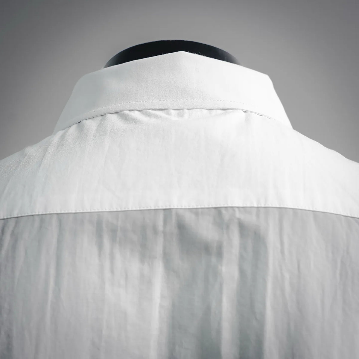White LOEWE button-up shirt with structured collar and yoke detail