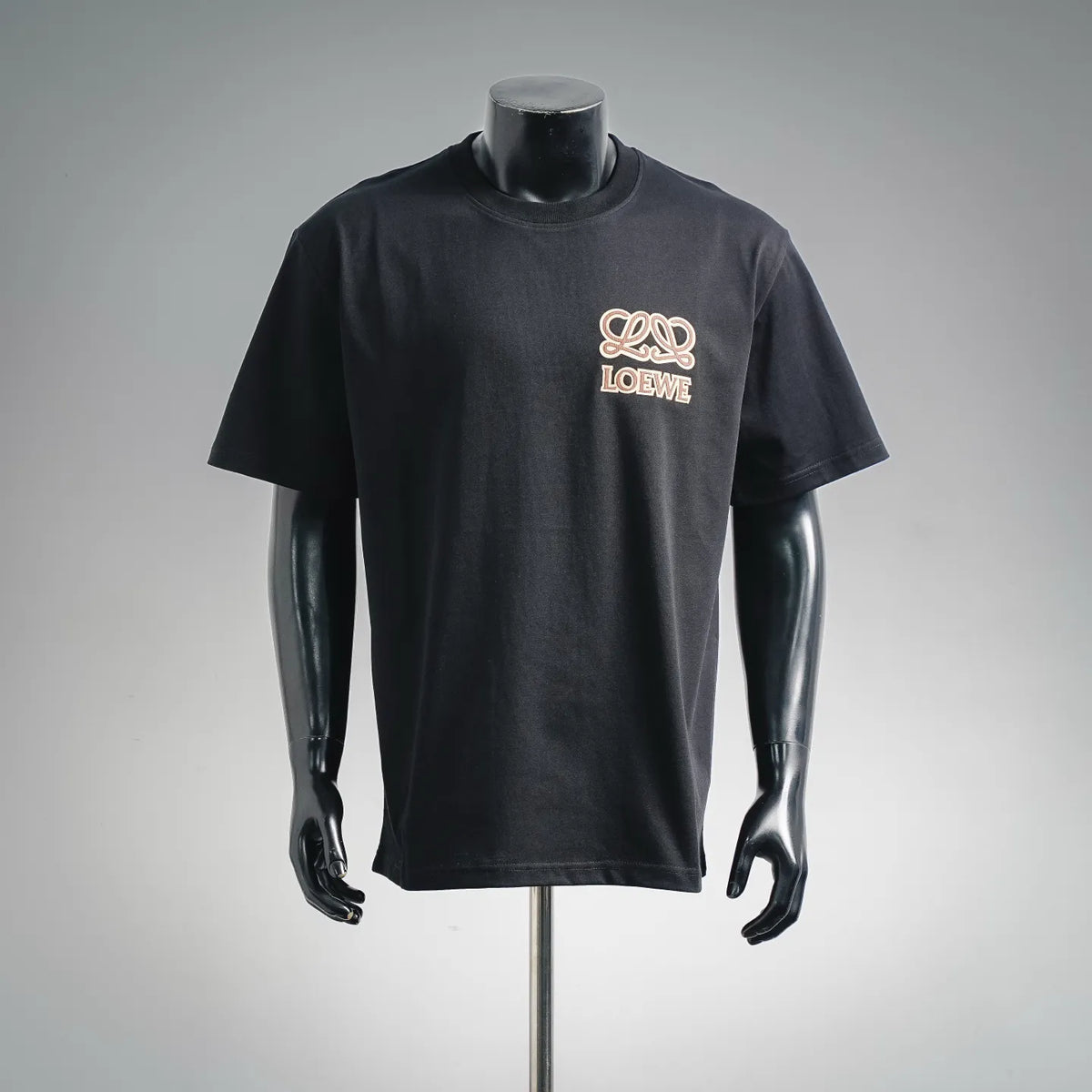 Black short-sleeve T-shirt with LOEWE logo graphic on the chest.