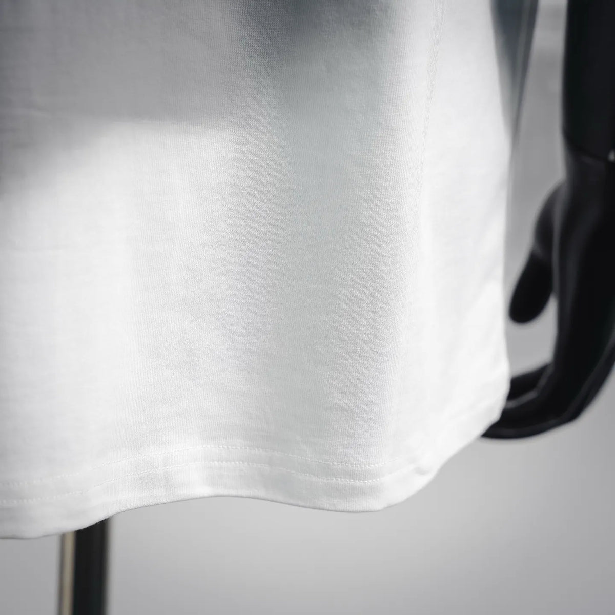 White T-shirt sleeve hem with stitched edge detail