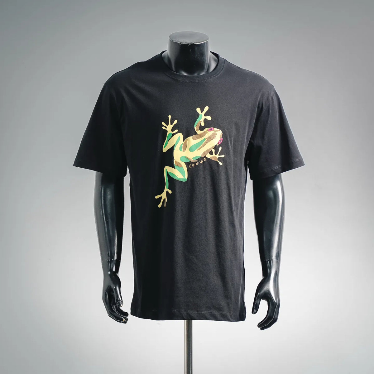 Black T-shirt with multicolor graphic dinosaur lizard artwork on the front