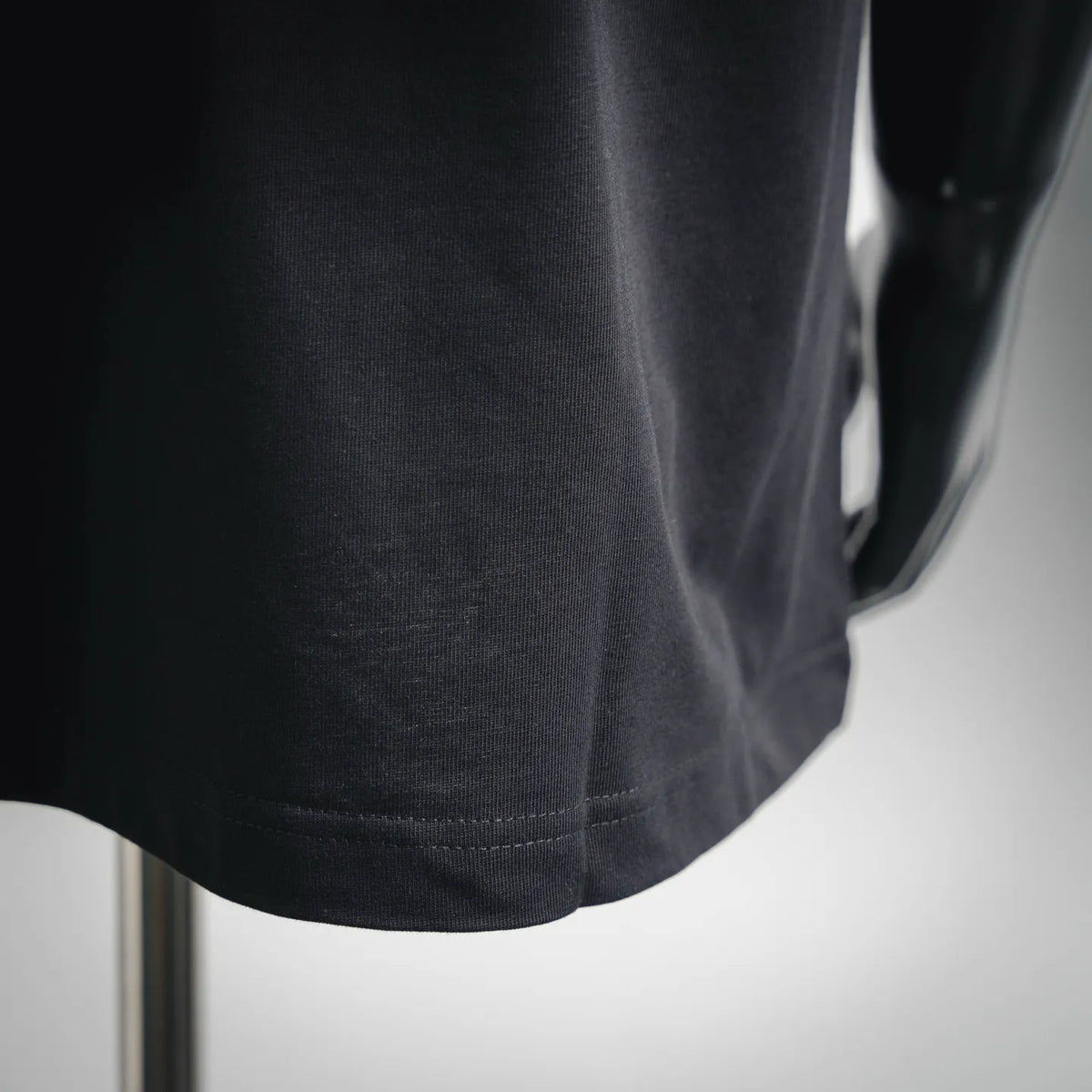 LOEWE graphic short-sleeve T-shirt hem detail in dark charcoal