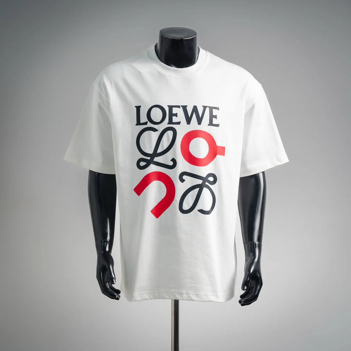 White LOEWE logo T-shirt with multicolor 'LOEWE' print on mannequin