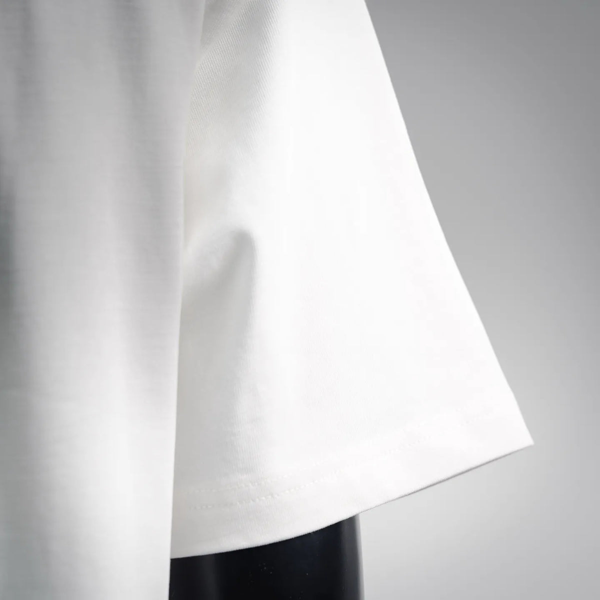 White T-shirt sleeve and side hem detail