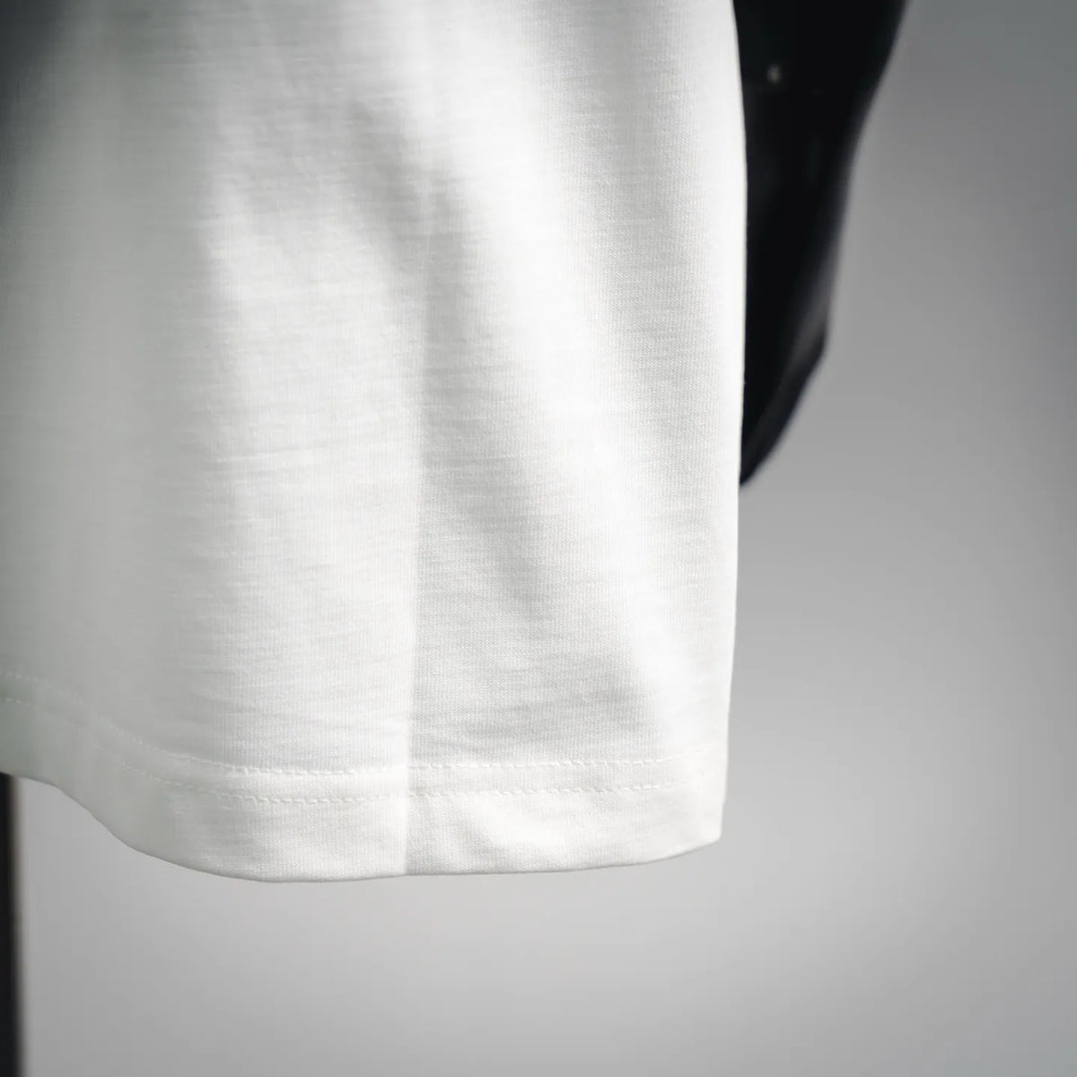White T-shirt hem with stitched cuff detail