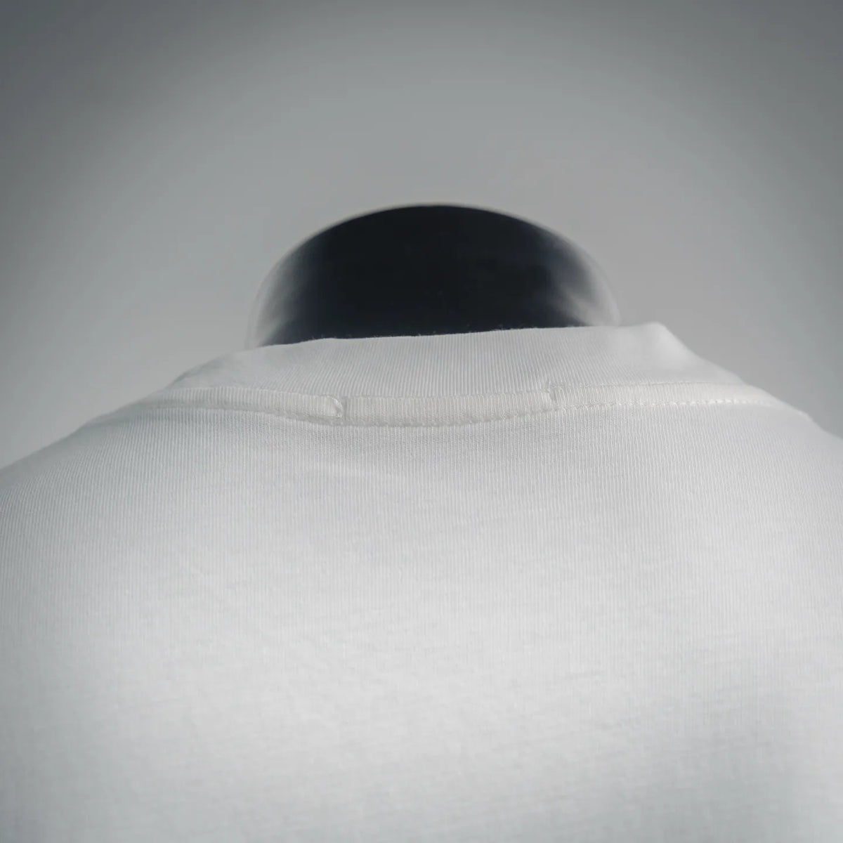White ribbed crew neckline on T-shirt