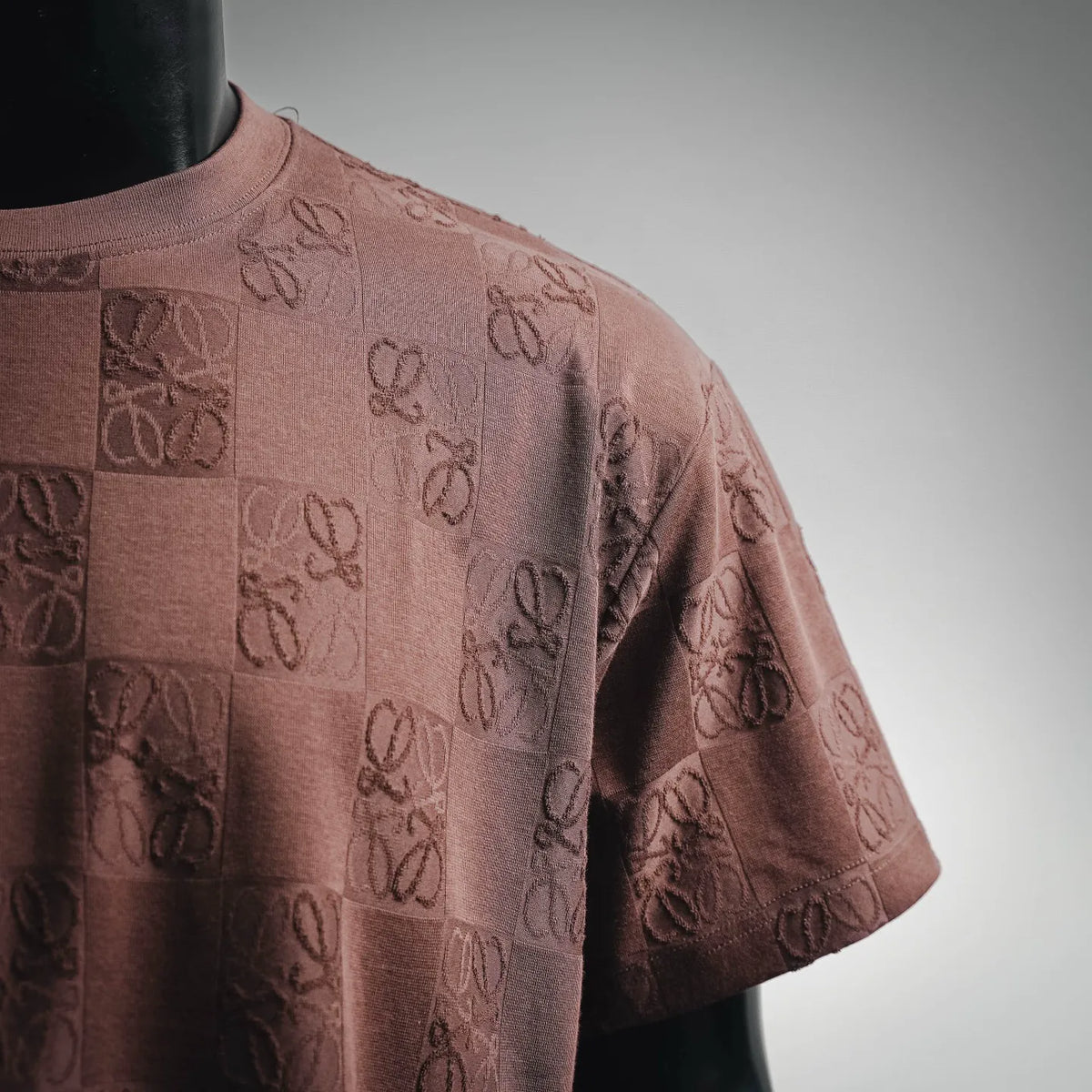 Taupe-brown crew-neck short-sleeve T-shirt with embossed repeating logo motif