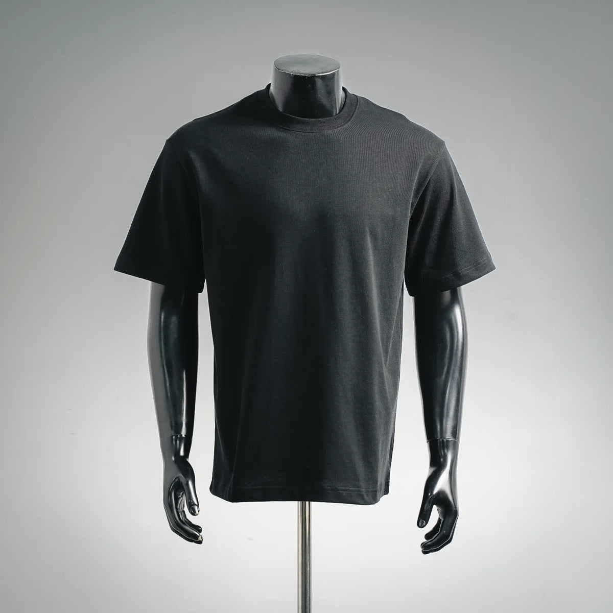 LOEWE short-sleeve T-shirt on a mannequin, dark fabric, crew neck, plain front