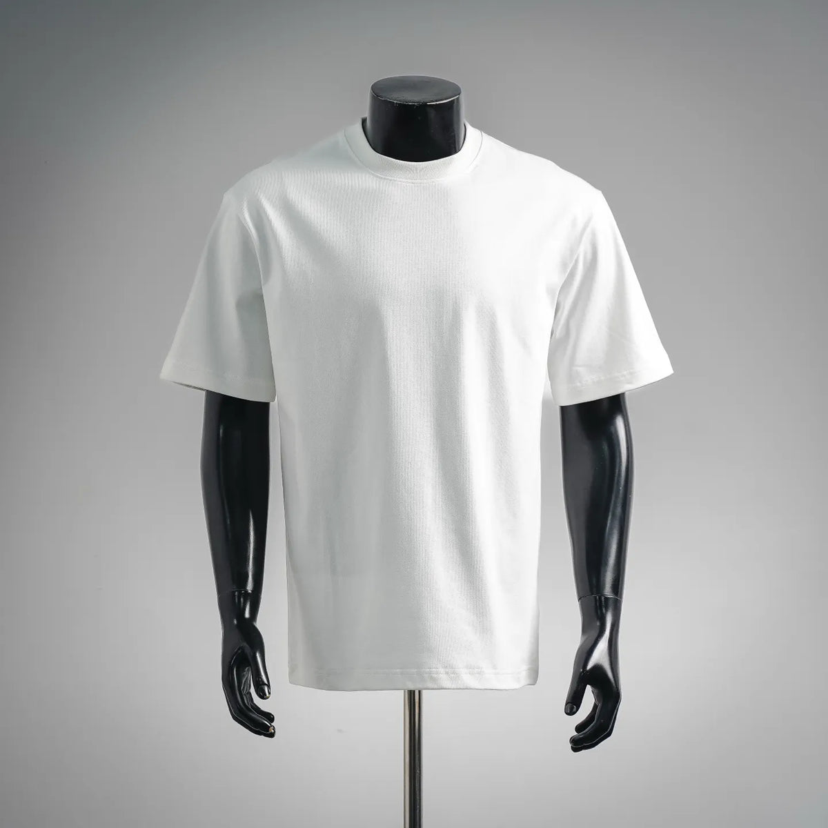 White short-sleeve LOEWE T-shirt on a mannequin, crew neck, straight hem.