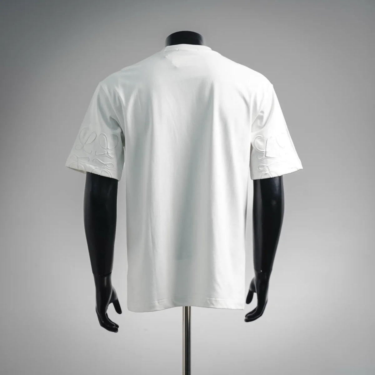 White short-sleeve LOEWE T-shirt back view on a mannequin, crew neck, straight hem.