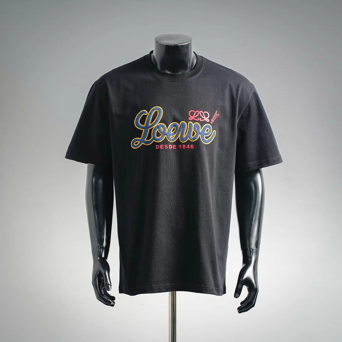 Black short-sleeve T-shirt with colorful LOEWE “DESDE 1846” graphic on chest