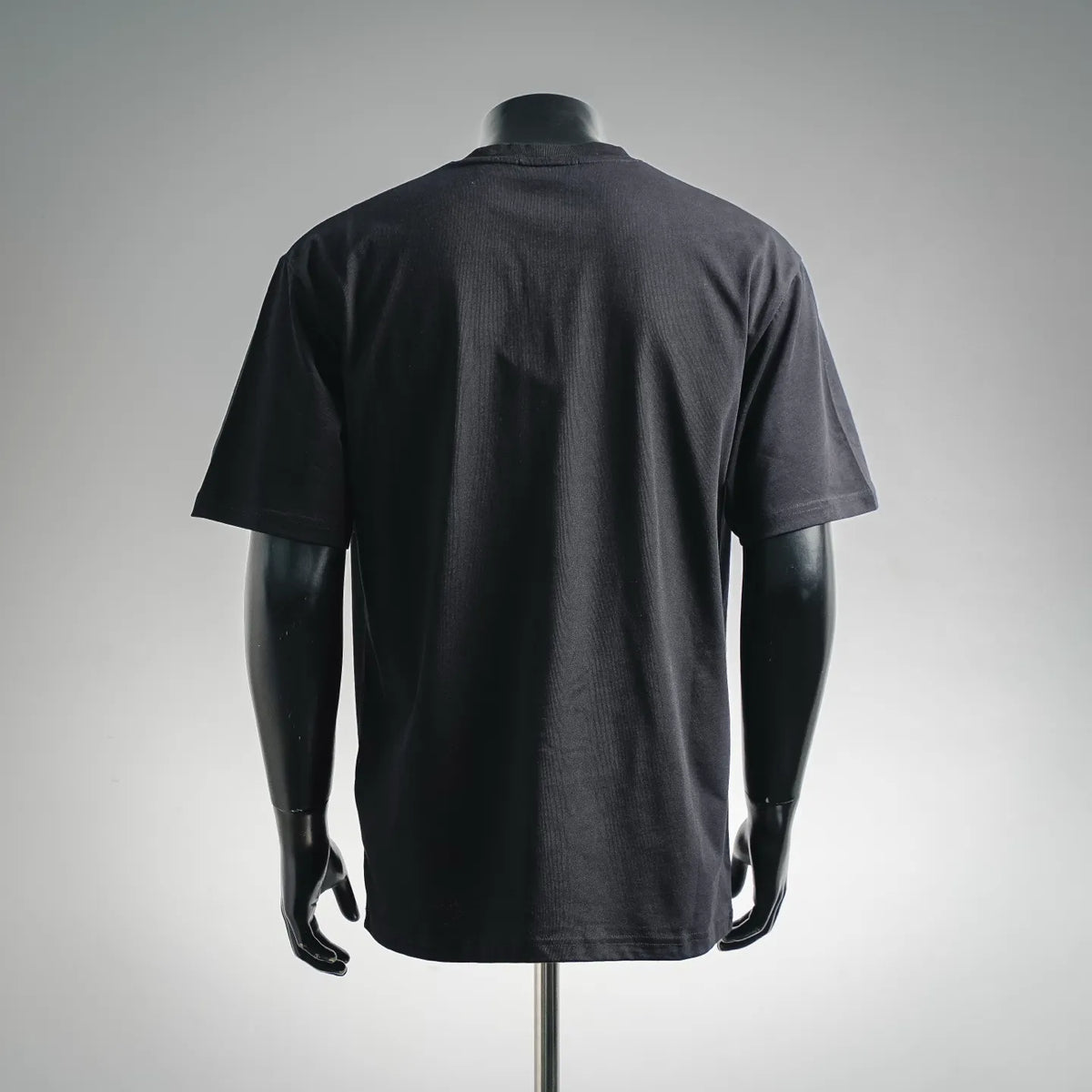 Black short-sleeve T-shirt on a mannequin, back view