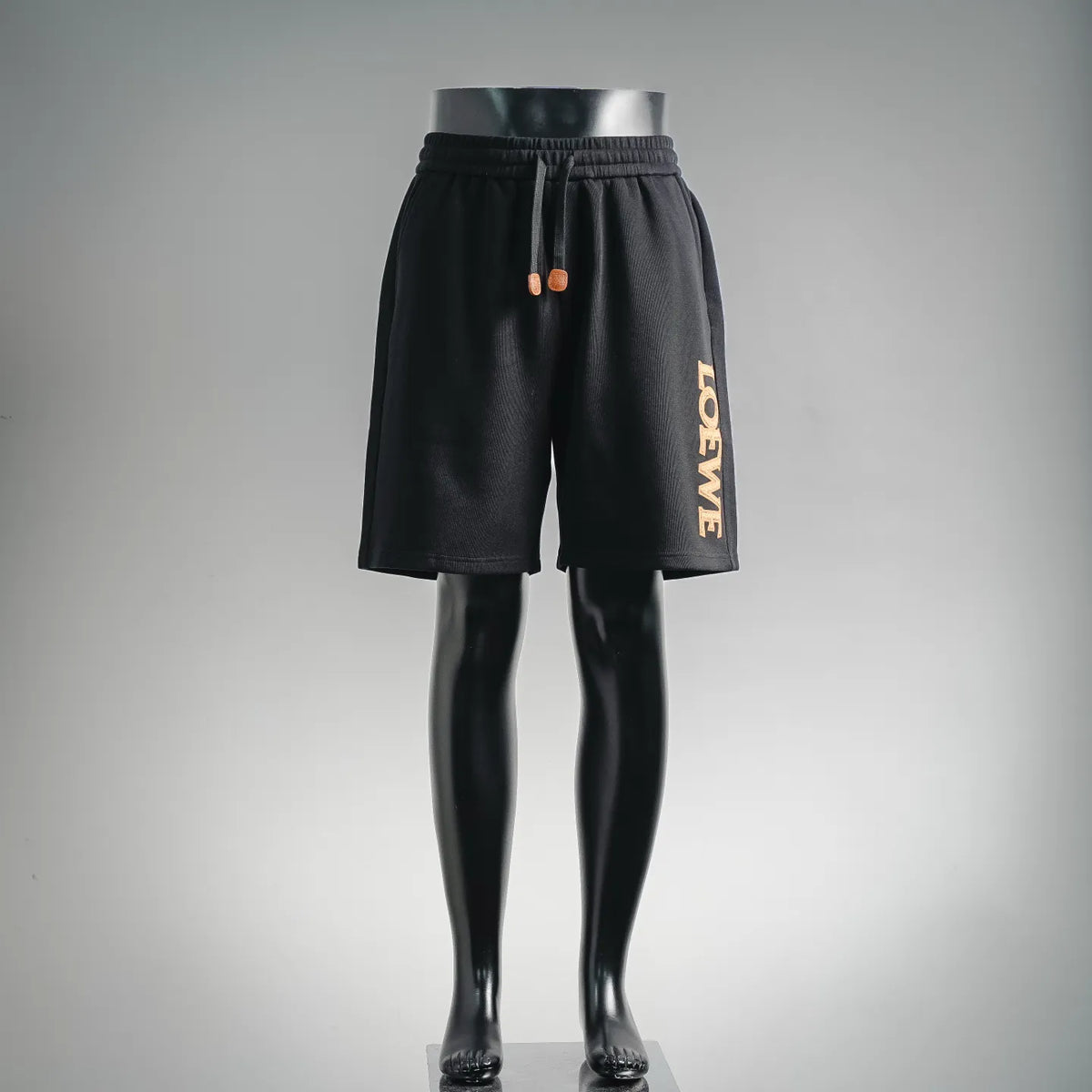 Black shorts with elastic waistband and LOEWE vertical logo patch on side