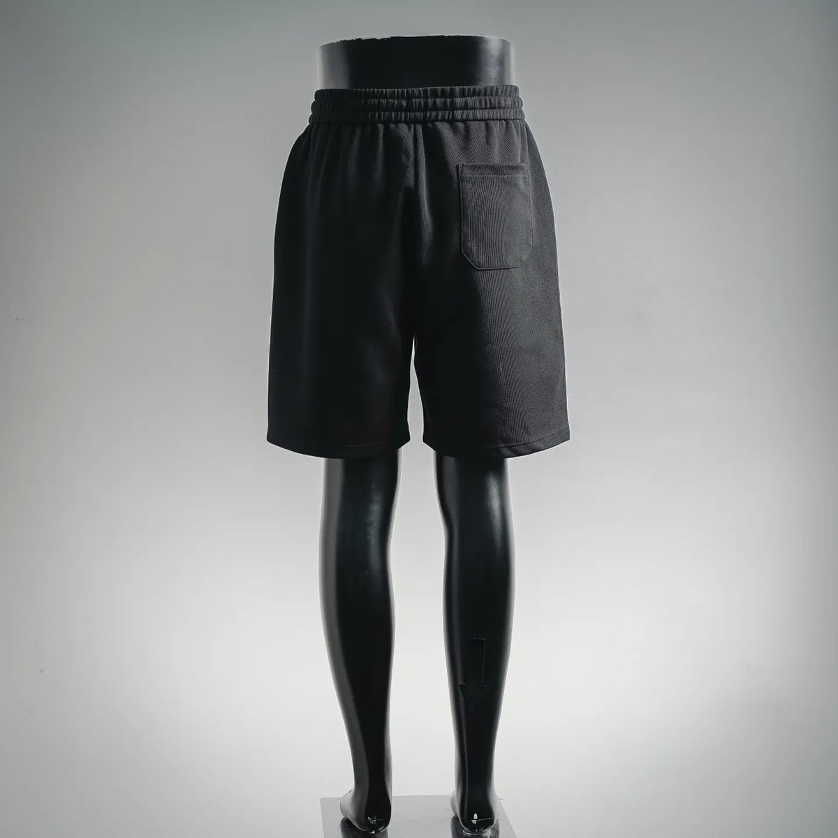 Black shorts with elastic waistband and visible rear pocket