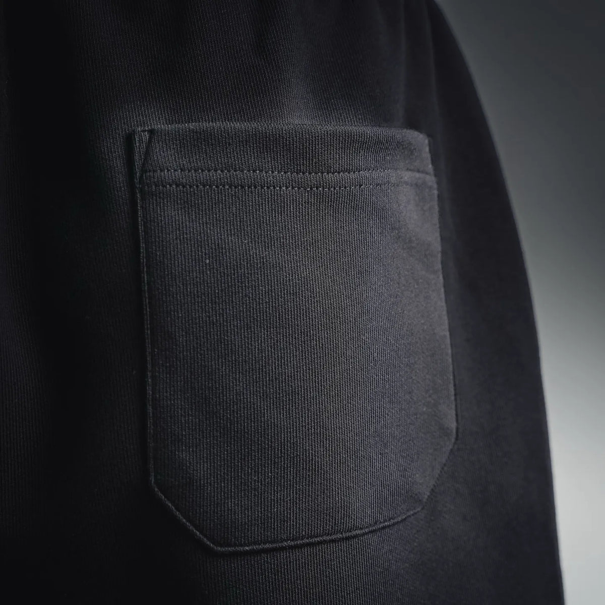 Black shorts with side pocket and neat stitched trim