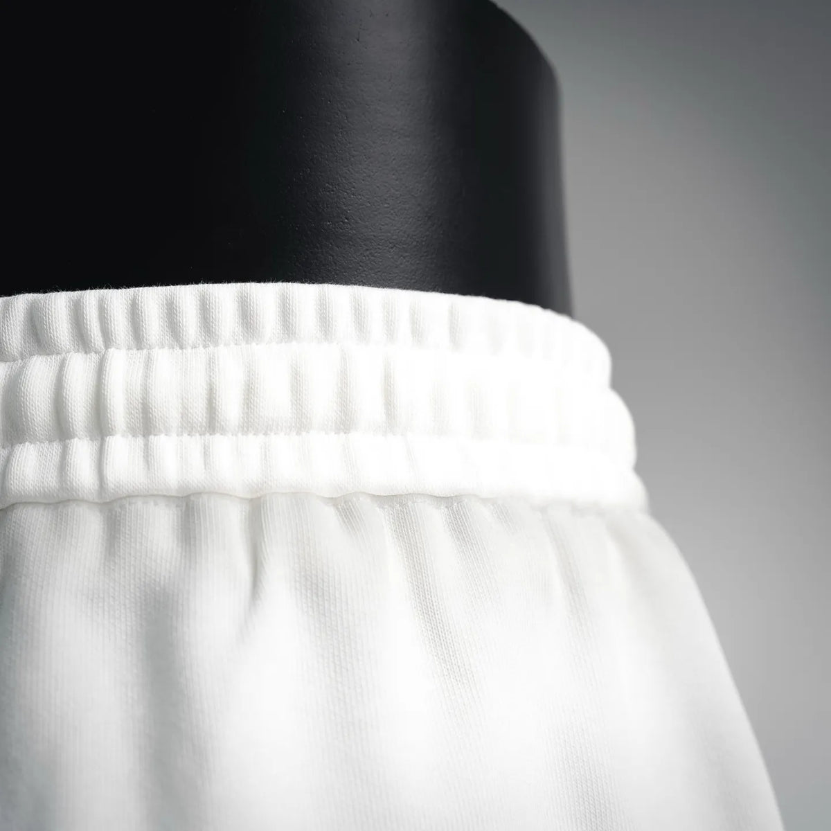 White elastic waistband with gathered fabric detail