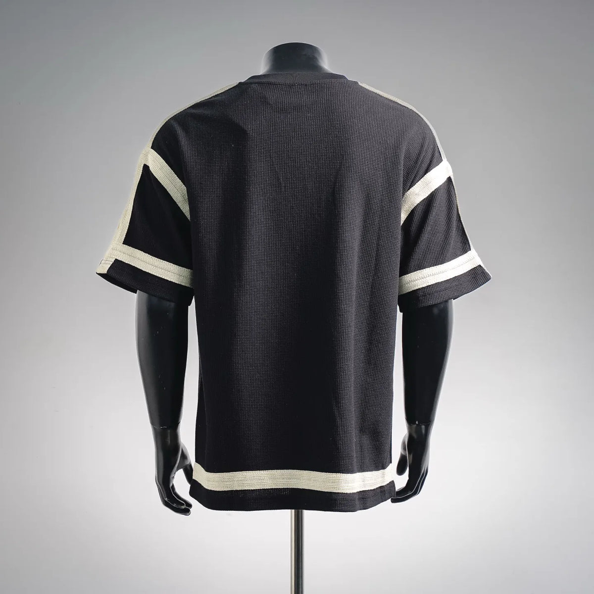 LOEWE black knit short-sleeve top, back view with cream sleeve stripes