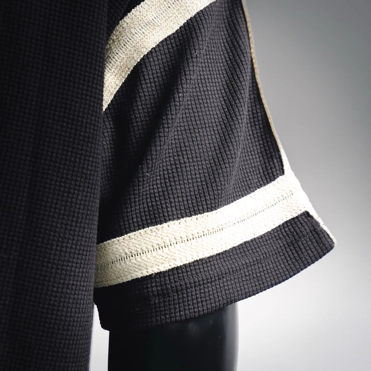 LOEWE black knit sleeve cuff with cream stripe band
