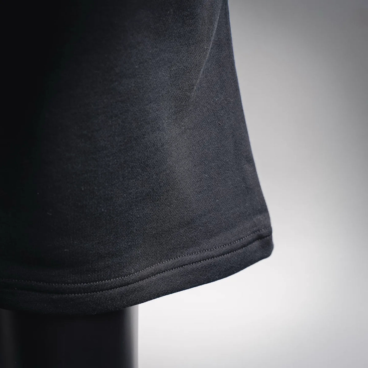 LOEWE black shorts with ribbed hem trim and textured knit fabric
