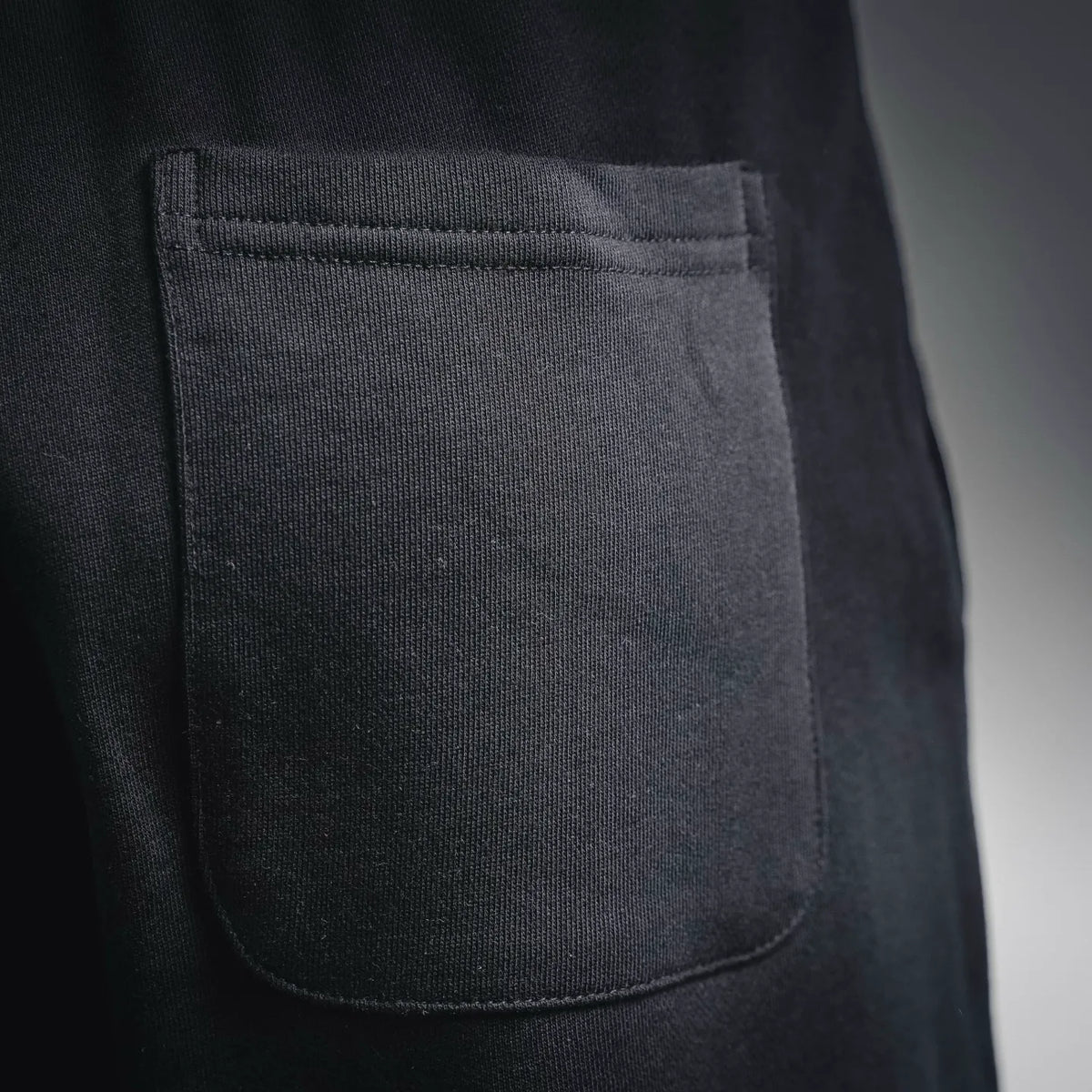 LOEWE black shorts with front patch pocket and visible stitching