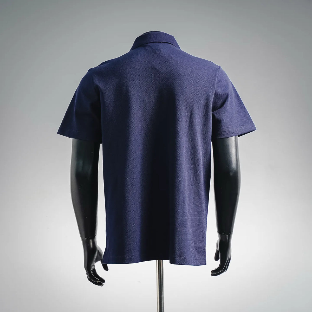 Dark blue short-sleeve polo shirt with plain back view