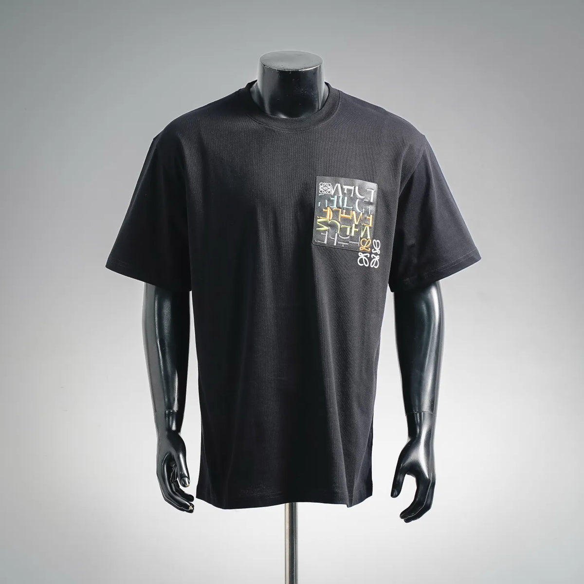 LOEWE graphic T-shirt, dark short-sleeve top with small chest rectangle print.