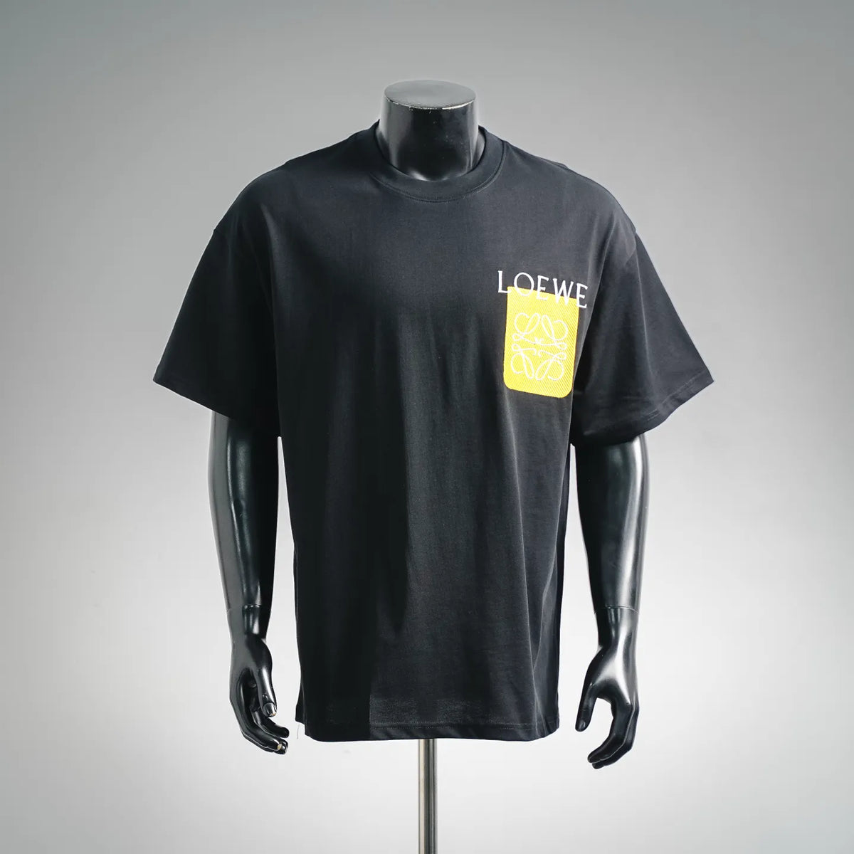 Black LOEWE short-sleeve T-shirt with yellow logo patch on the chest