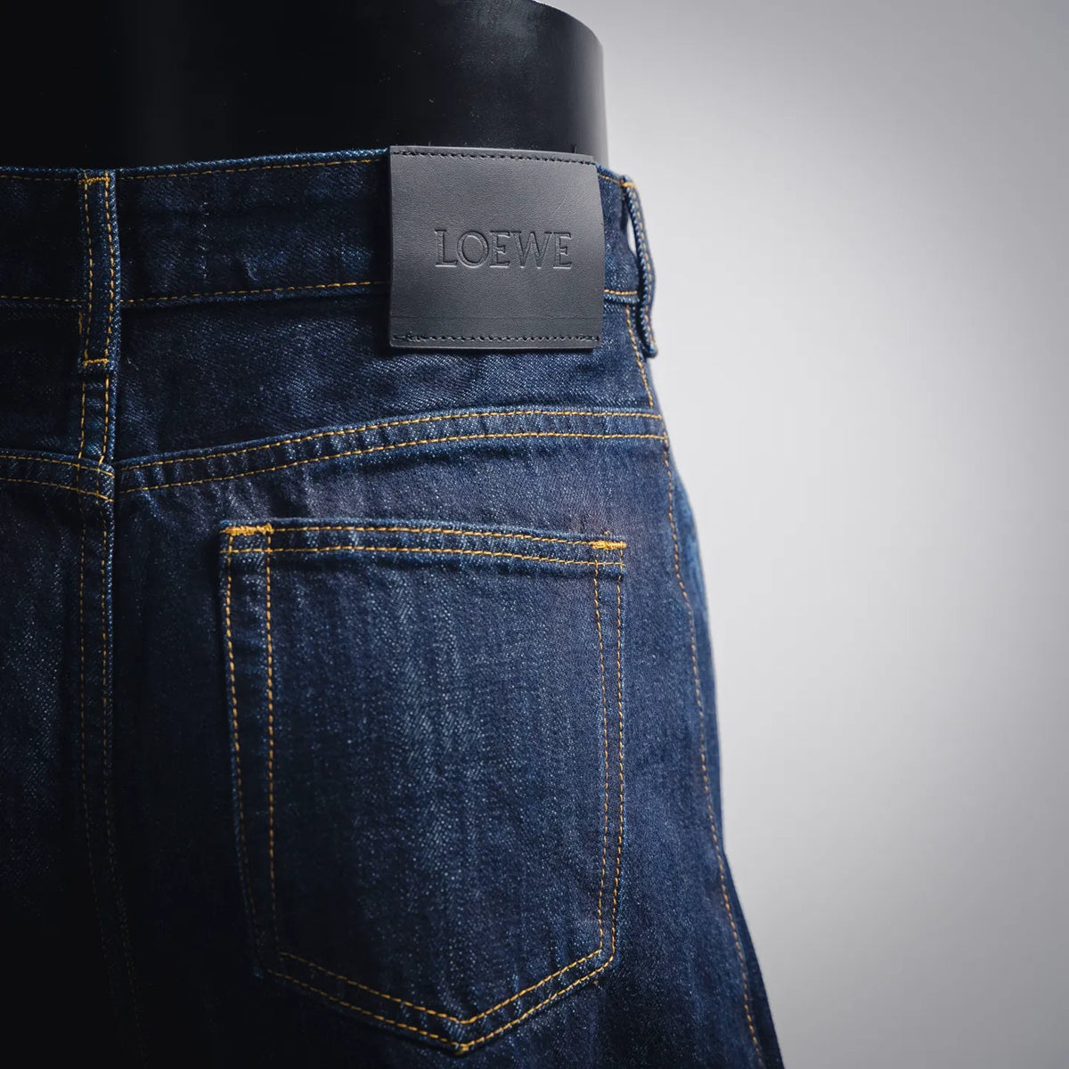 Dark blue denim pants with LOEWE leather patch and stitched back pocket