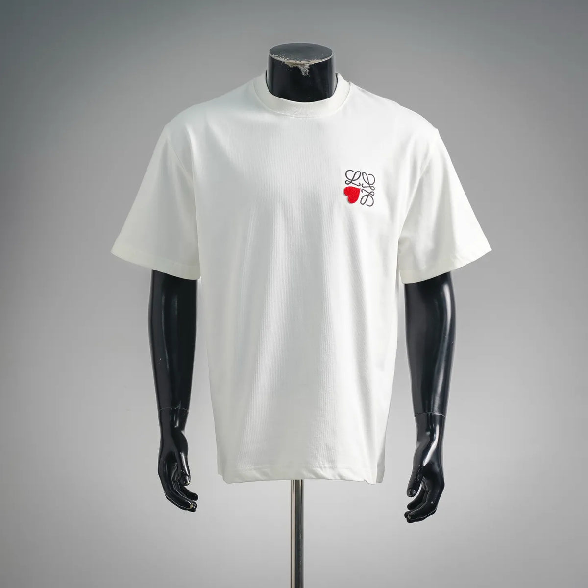 White crew-neck short-sleeve T-shirt with small LOEWE logo on the chest