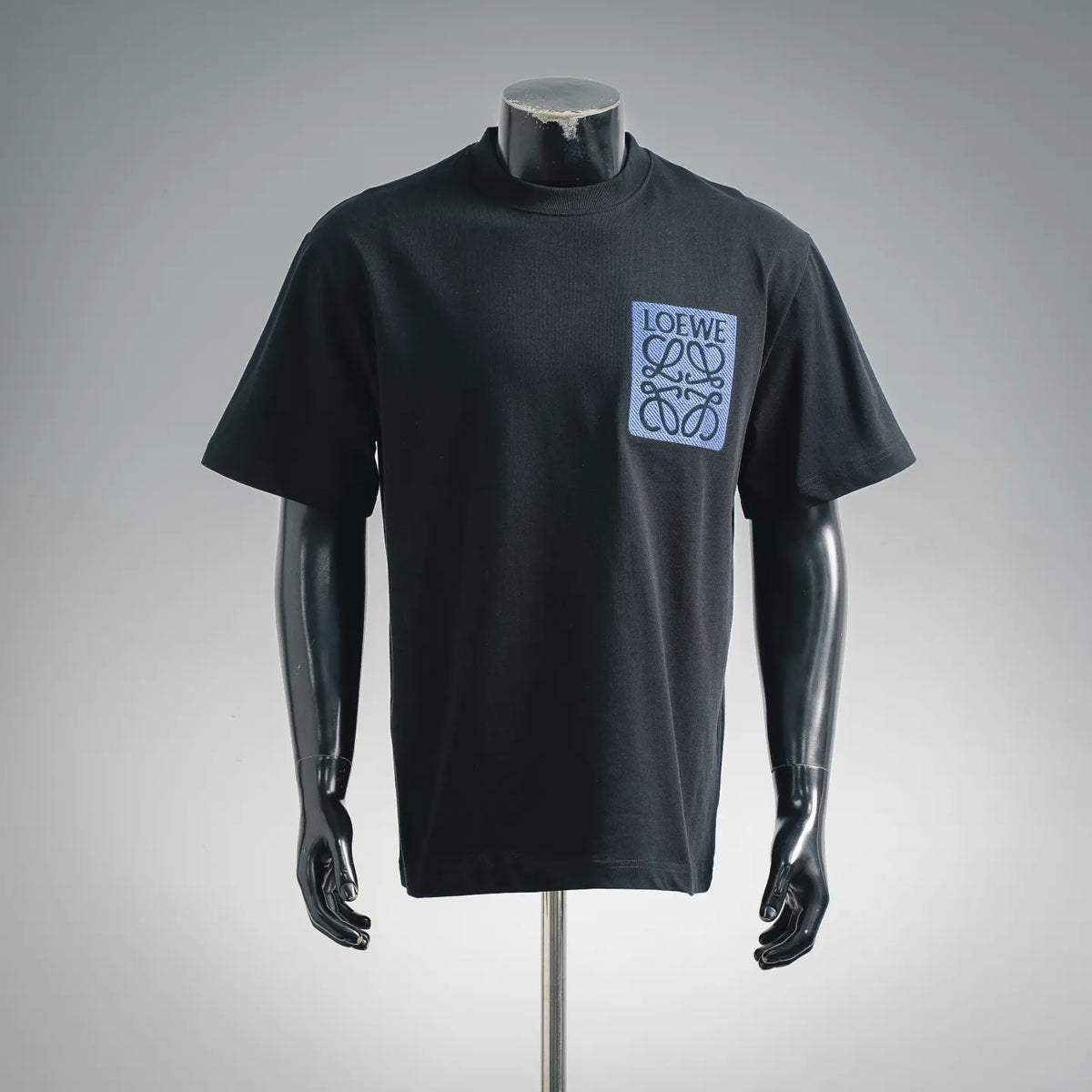 Black short-sleeve T-shirt with blue LOEWE logo patch on chest