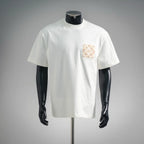 White short-sleeve T-shirt with small beige logo patch on left chest