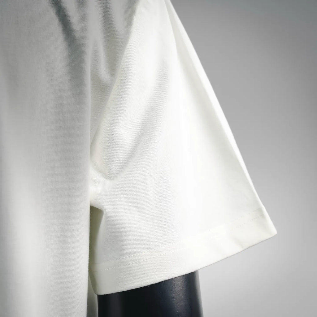 White short-sleeve T-shirt with curved hem and soft drape