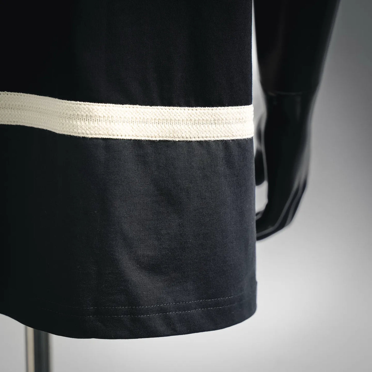 Black T-shirt hem band with contrast white stripe