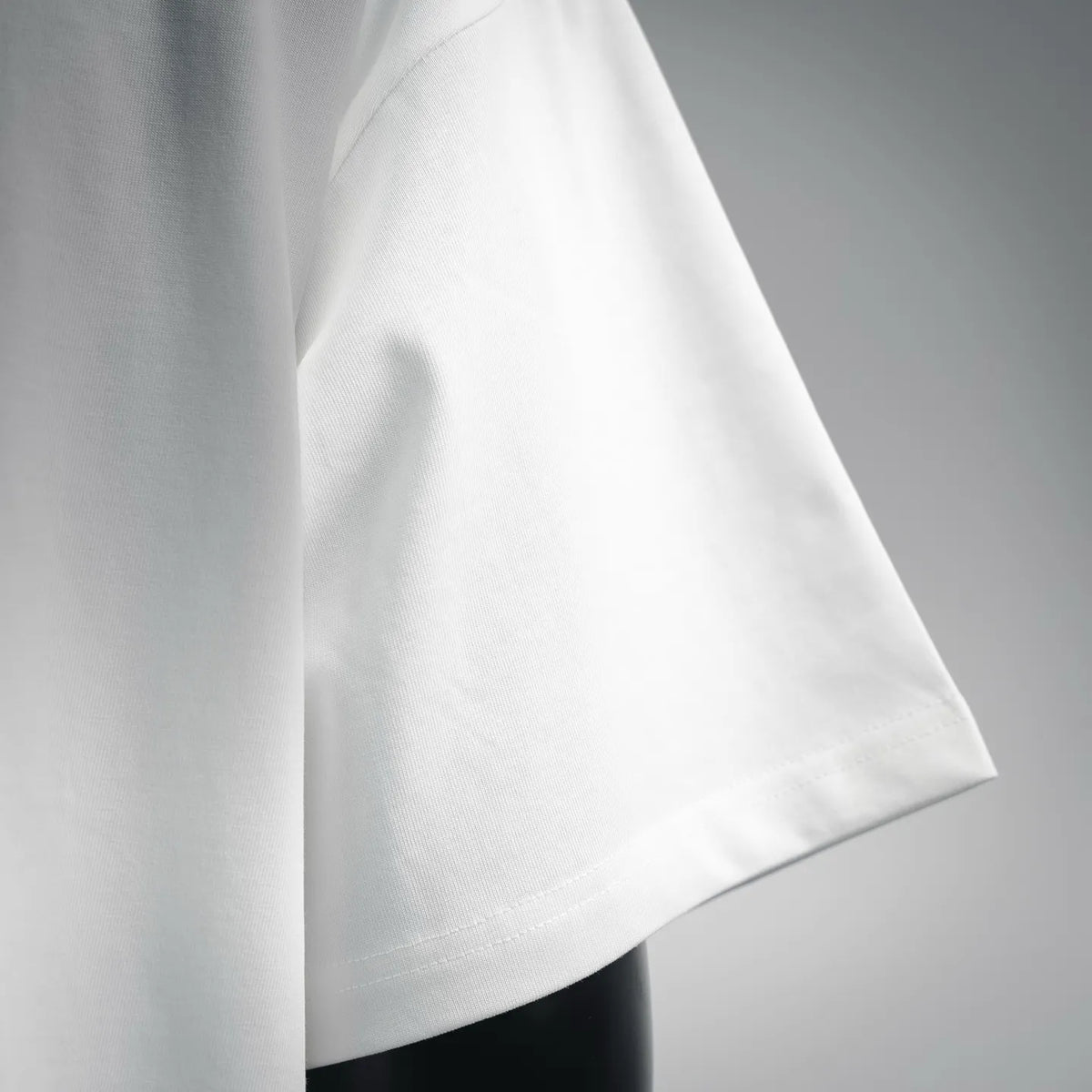 White LOEWE short-sleeve T-shirt side view, smooth fabric and stitched hem