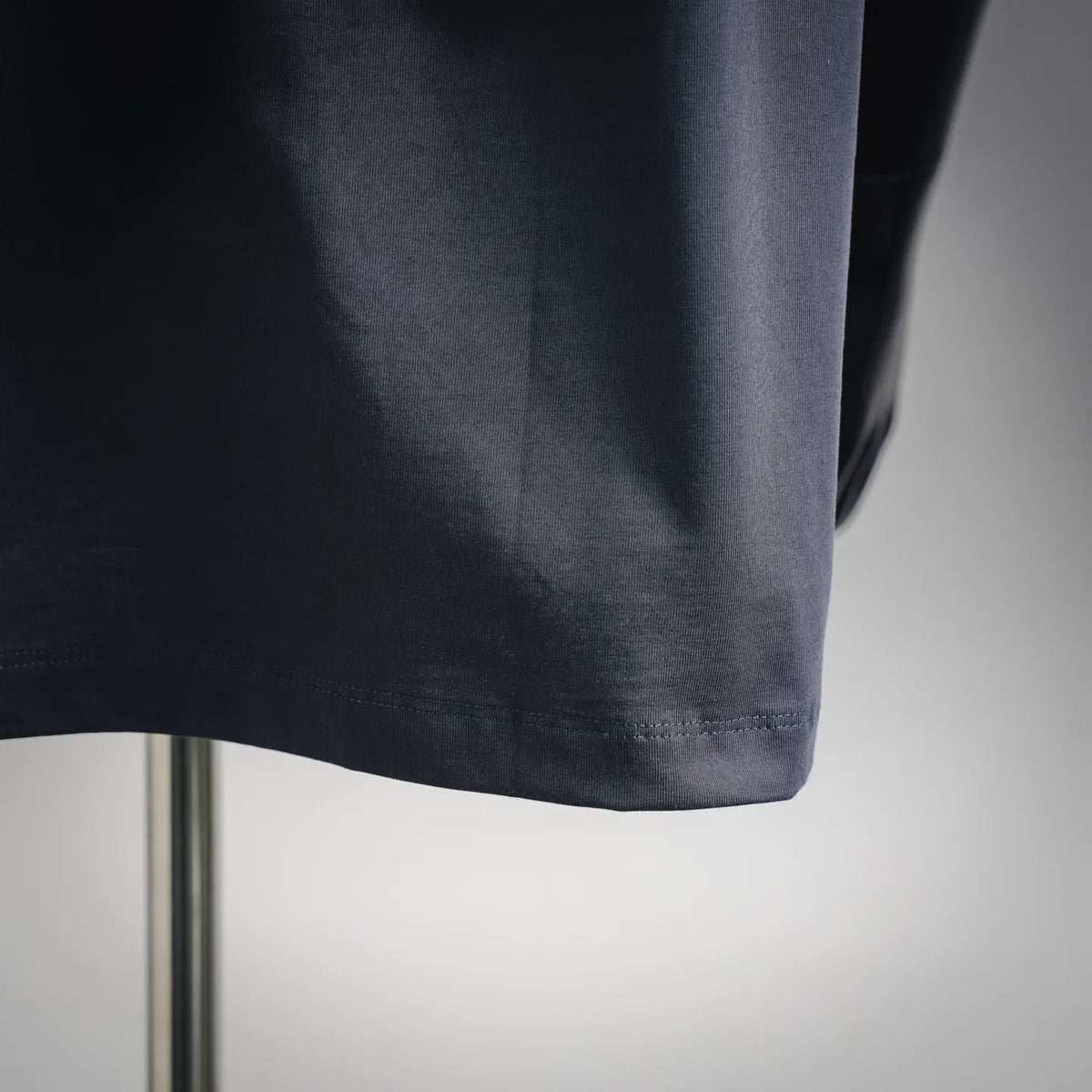 Dark blue LOEWE T-shirt hem and side seam detail