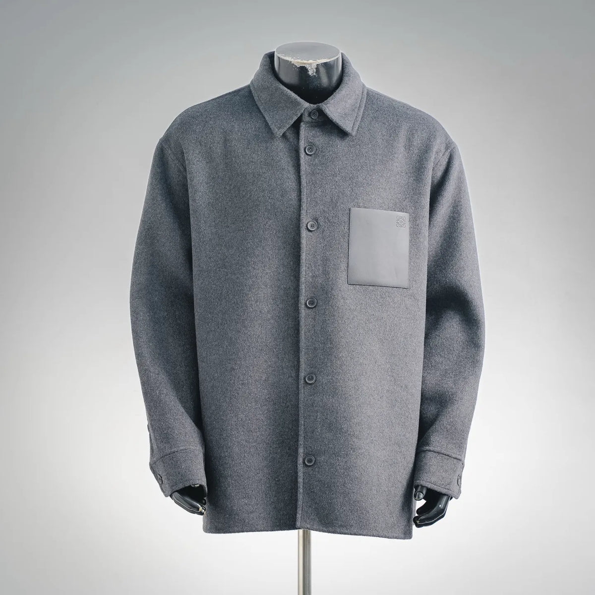 Dark gray wool coat front, button placket and patch chest pocket