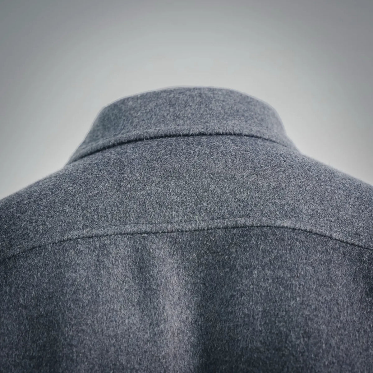 Dark gray wool coat back yoke close-up