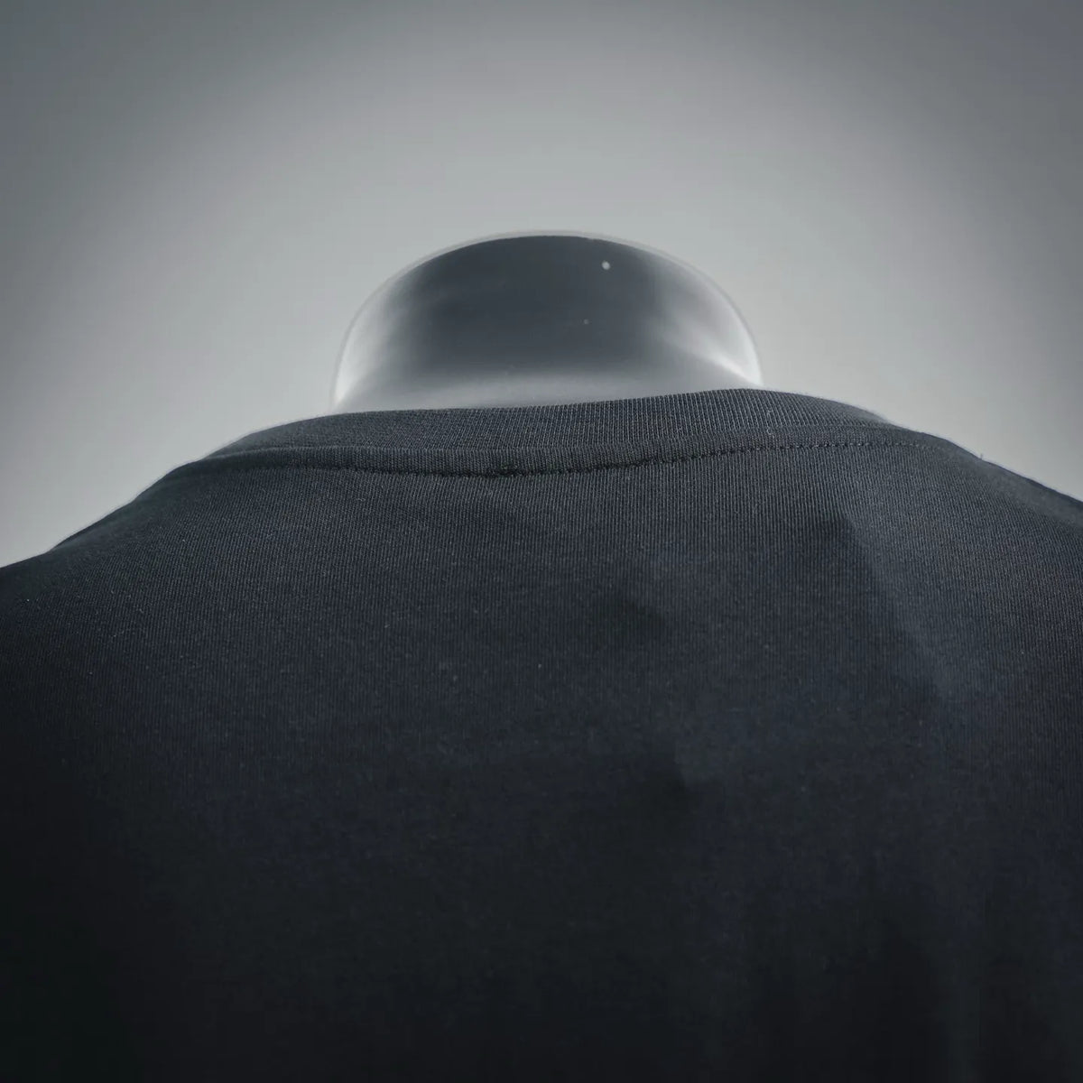 Black crewneck T-shirt neckline and upper back seam detail