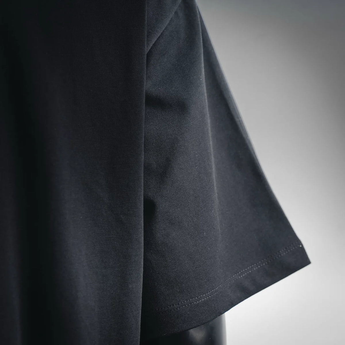 Black crewneck T-shirt short sleeve hem with stitched edge